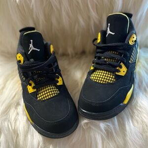 Brand new Jordan 4’s black, and yellow…